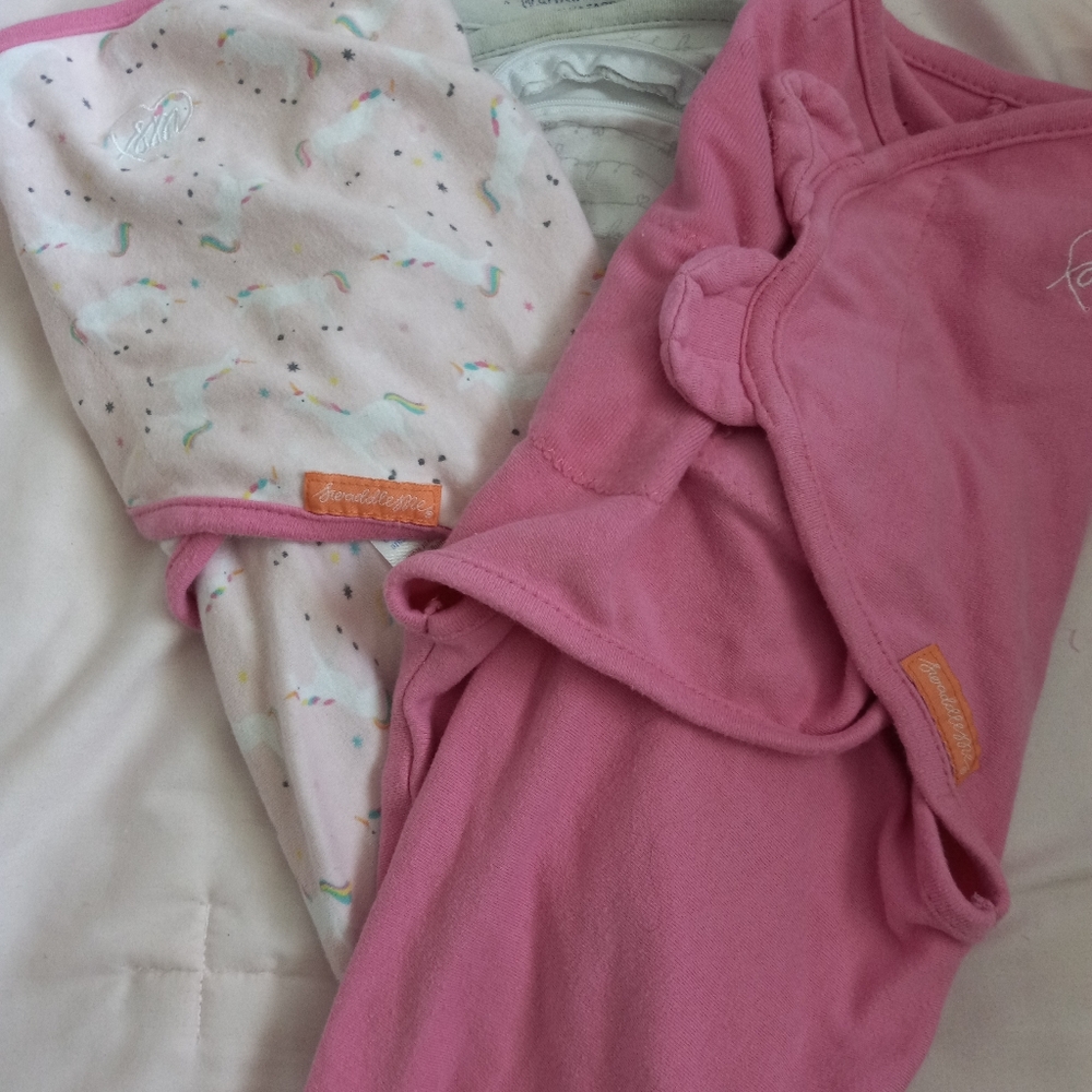 2 swaddles that unzip at bottom for convenience  with diaper changes.